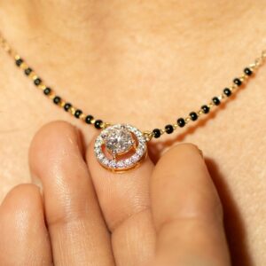 Close-up of a traditional Indian gold and diamond necklace with intricate design and craftsmanship.